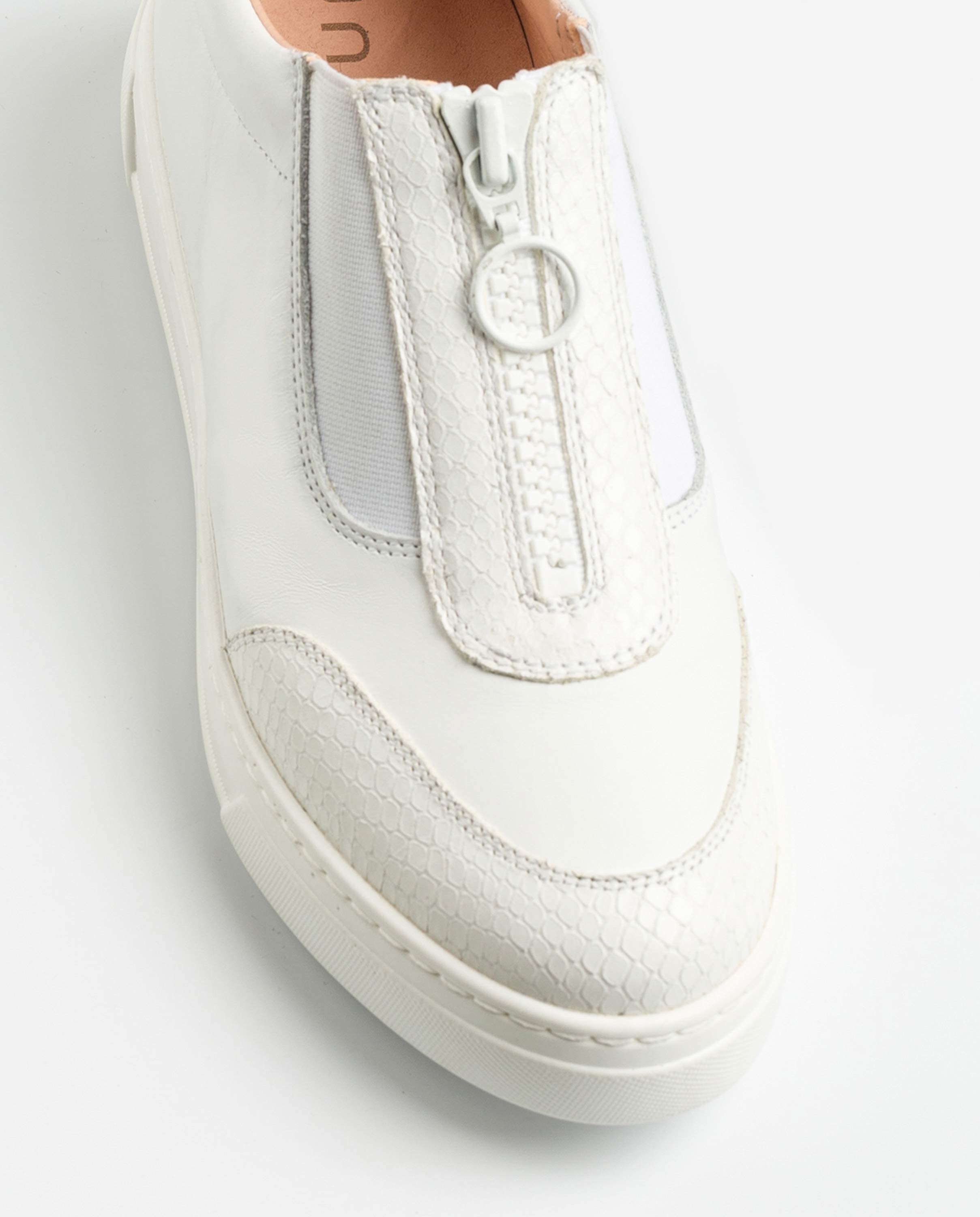white sneakers with zipper